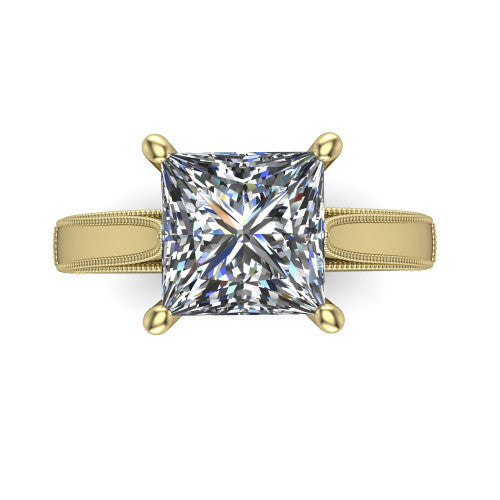 Adeline princess solitaire engagement ring in 14K Yellow Gold, top-down view showing the brilliant princess-cut center diamond held by four prongs above a squared milgrain band