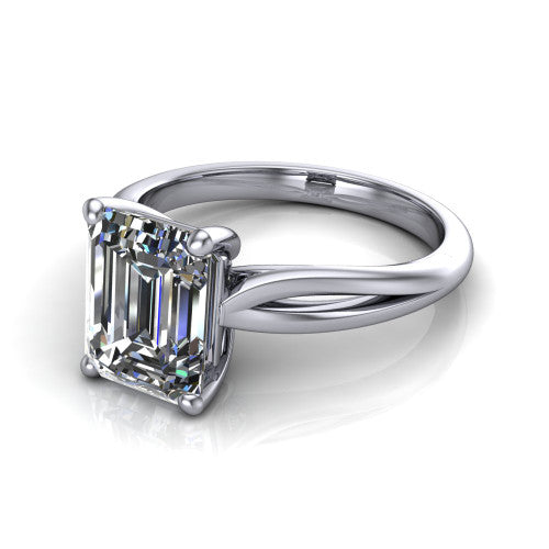 Beatrice emerald solitaire engagement ring in Platinum, three-quarter perspective showing the step-cut emerald center diamond on a slim polished band with trellis crossover gallery