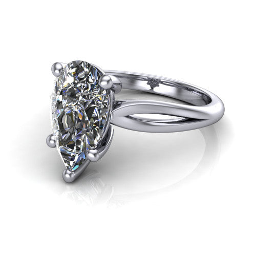 Beatrice pear solitaire engagement ring in Platinum, three-quarter perspective showing the brilliant pear-cut center diamond on a slim polished band with trellis crossover gallery