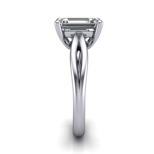 Beatrice emerald solitaire engagement ring in 18K White Gold, side profile showing the trellis crossover arms beneath the head and slim polished band