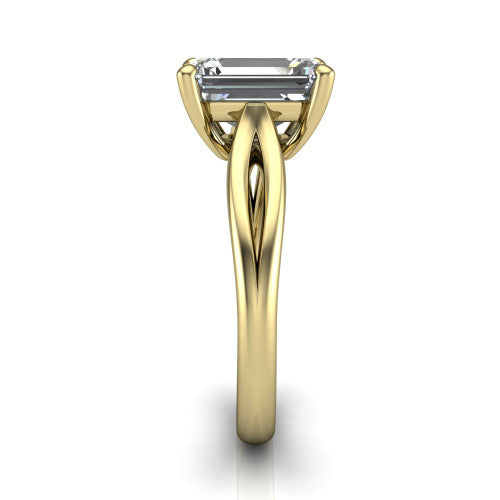 Beatrice emerald solitaire engagement ring in 14K Yellow Gold, side profile showing the trellis crossover arms beneath the head and slim polished band