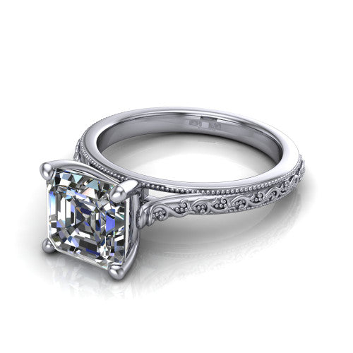 Violet square emerald solitaire engagement ring in 18K White Gold, three-quarter perspective showing the step-cut square emerald center diamond on a hand-engraved scroll shank with milgrain edges