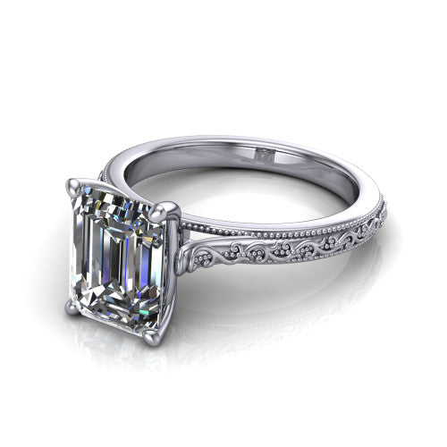 Violet emerald solitaire engagement ring in 14K White Gold, three-quarter perspective showing the step-cut emerald center diamond on a hand-engraved scroll shank with milgrain edges