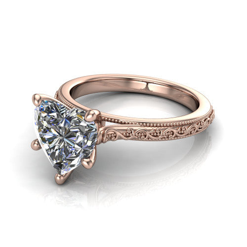 Violet heart solitaire engagement ring in 14K Rose Gold, three-quarter perspective showing the brilliant heart-shaped center diamond on a hand-engraved scroll shank with milgrain edges