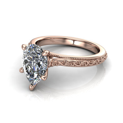 Violet pear solitaire engagement ring in 18K Rose Gold, three-quarter perspective showing the brilliant pear-cut center diamond on a hand-engraved scroll shank with milgrain edges