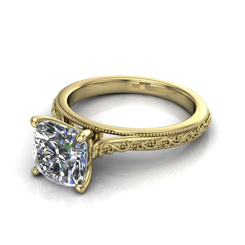 Violet cushion solitaire engagement ring in 18K Yellow Gold, three-quarter perspective showing the brilliant cushion-cut center diamond on a hand-engraved scroll shank with milgrain edges