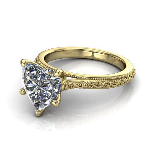 Violet heart solitaire engagement ring in 18K Yellow Gold, three-quarter perspective showing the brilliant heart-shaped center diamond on a hand-engraved scroll shank with milgrain edges