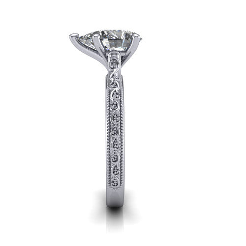 Violet pear solitaire engagement ring in Platinum, side profile showing the hand-engraved scroll motif and milgrain bead edges along the shank