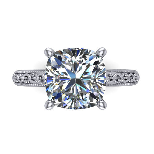 Violet cushion solitaire engagement ring in Platinum, top-down view showing the brilliant cushion-cut center diamond held by four prongs above the engraved shank