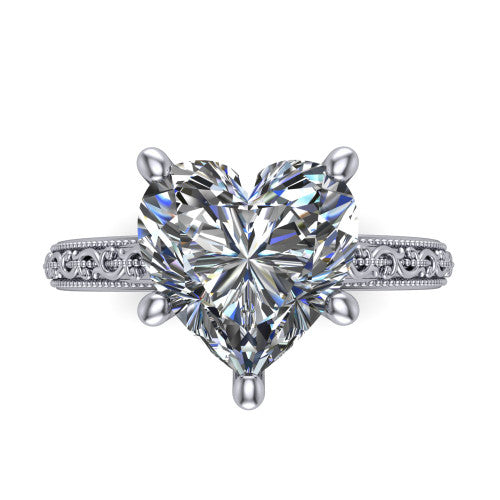 Violet heart solitaire engagement ring in 14K White Gold, top-down view showing the brilliant heart-shaped center diamond held by four prongs above the engraved shank