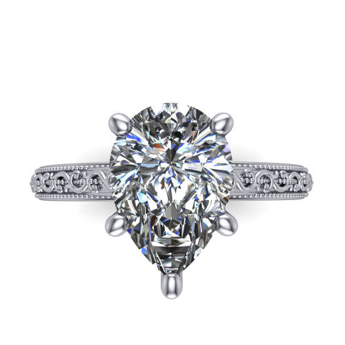 Violet pear solitaire engagement ring in Platinum, top-down view showing the brilliant pear-cut center diamond held by four prongs above the engraved shank