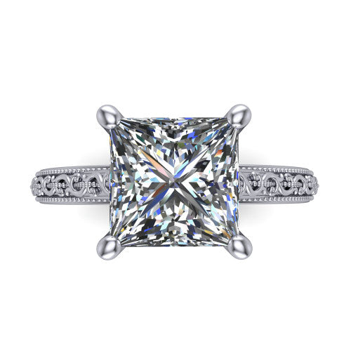 Violet princess solitaire engagement ring in 18K White Gold, top-down view showing the brilliant princess-cut center diamond held by four prongs above the engraved shank