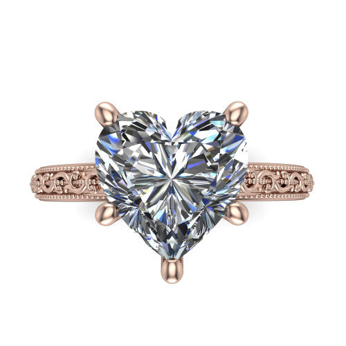 Violet heart solitaire engagement ring in 18K Rose Gold, top-down view showing the brilliant heart-shaped center diamond held by four prongs above the engraved shank