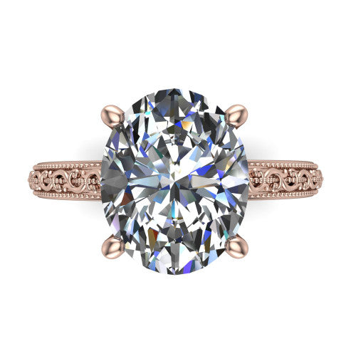 Violet oval solitaire engagement ring in 18K Rose Gold, top-down view showing the brilliant oval center diamond held by four prongs above the engraved shank