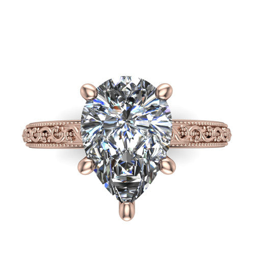 Violet pear solitaire engagement ring in 14K Rose Gold, top-down view showing the brilliant pear-cut center diamond held by four prongs above the engraved shank