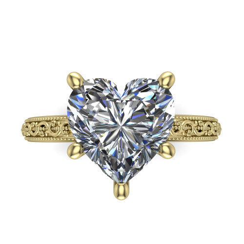 Violet heart solitaire engagement ring in 18K Yellow Gold, top-down view showing the brilliant heart-shaped center diamond held by four prongs above the engraved shank