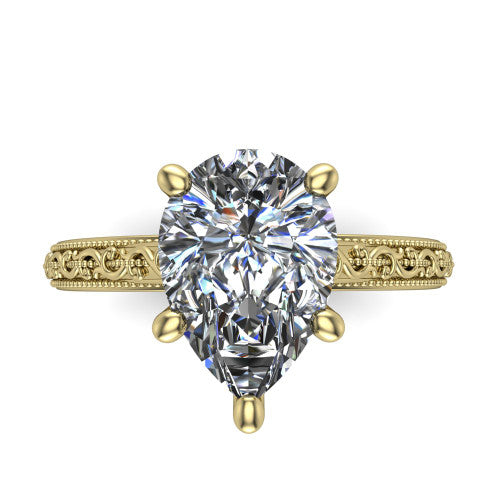Violet pear solitaire engagement ring in 18K Yellow Gold, top-down view showing the brilliant pear-cut center diamond held by four prongs above the engraved shank