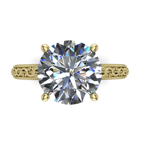 Violet round solitaire engagement ring in 14K Yellow Gold, top-down view showing the brilliant round center diamond held by four prongs above the engraved shank