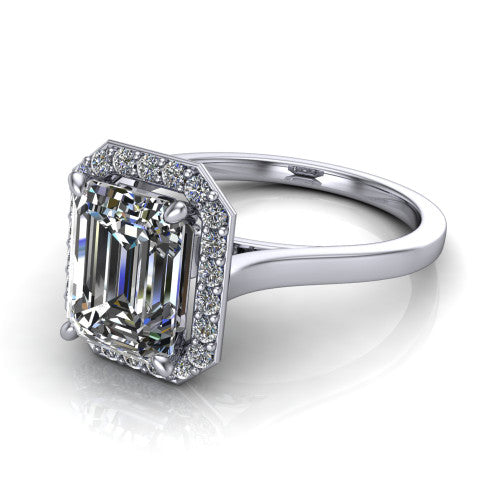Anastasia emerald halo engagement ring in Platinum, three-quarter perspective showing the step-cut emerald center diamond inside a slim pave halo on cathedral shoulders