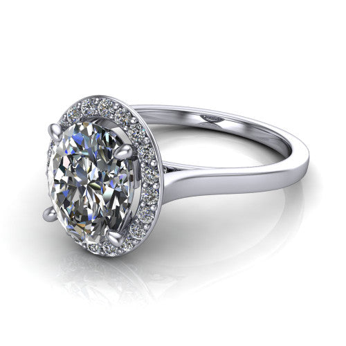 Anastasia oval halo engagement ring in 14K White Gold, three-quarter perspective showing the brilliant oval center diamond inside a slim pave halo on cathedral shoulders
