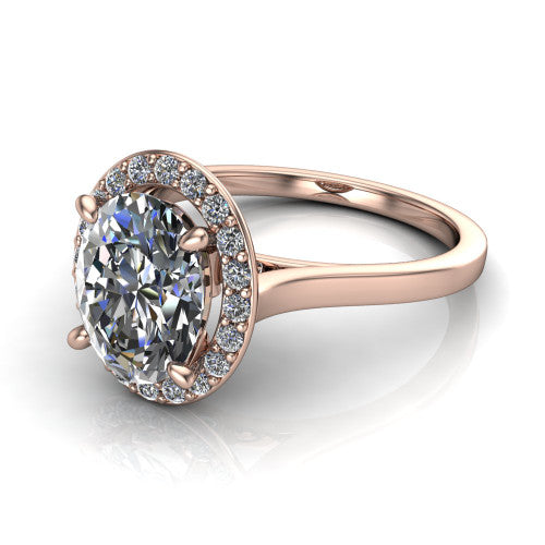 Anastasia oval halo engagement ring in 18K Rose Gold, three-quarter perspective showing the brilliant oval center diamond inside a slim pave halo on cathedral shoulders