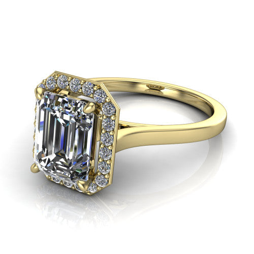 Anastasia emerald halo engagement ring in 18K Yellow Gold, three-quarter perspective showing the step-cut emerald center diamond inside a slim pave halo on cathedral shoulders
