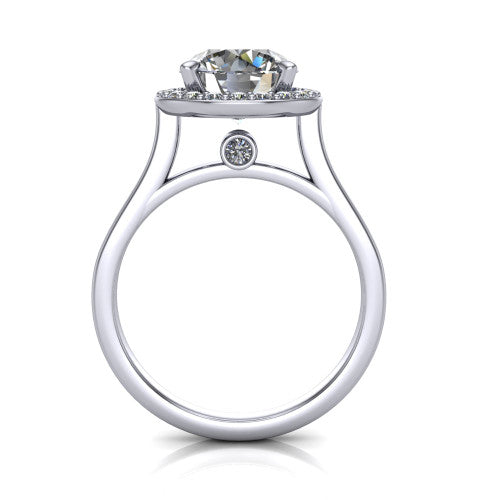 Anastasia round halo engagement ring in Platinum, through-finger front profile showing the halo head, cathedral shoulders, and hidden surprise diamond in the under-gallery