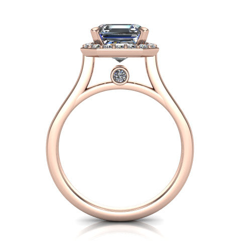 Anastasia square emerald halo engagement ring in 14K Rose Gold, through-finger front profile showing the halo head, cathedral shoulders, and hidden surprise diamond in the under-gallery