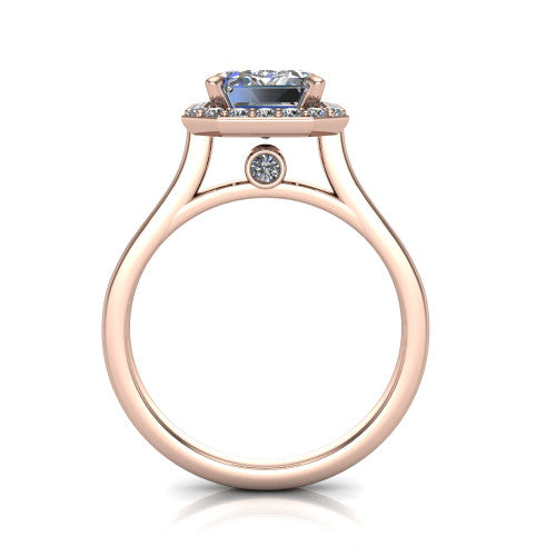 Anastasia emerald halo engagement ring in 18K Rose Gold, through-finger front profile showing the halo head, cathedral shoulders, and hidden surprise diamond in the under-gallery