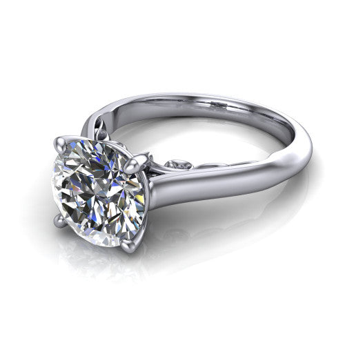 Saylor round solitaire engagement ring in Platinum, three-quarter perspective showing the brilliant round center diamond on a 4-prong cathedral head with filigree gallery