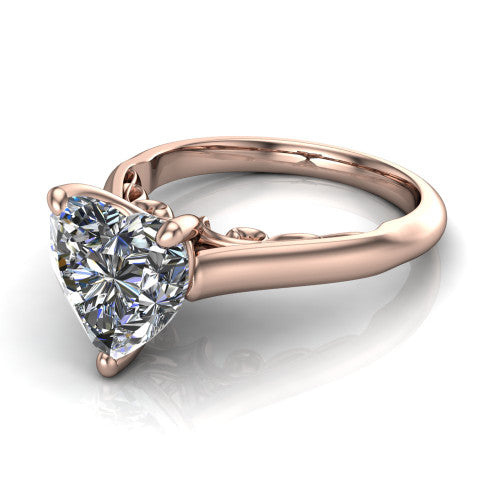 Saylor heart solitaire engagement ring in 18K Rose Gold, three-quarter perspective showing the brilliant heart-shaped center diamond on a 4-prong cathedral head with filigree gallery