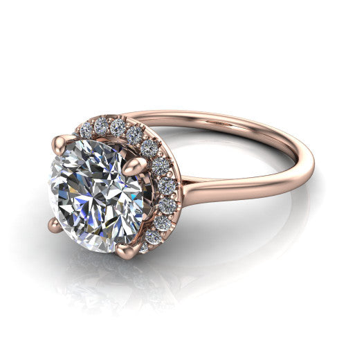 Florence round halo engagement ring in 14K Rose Gold, three-quarter perspective showing the brilliant round center diamond inside a slim pave halo on a thin knife-edge band