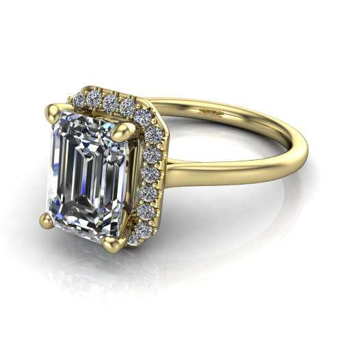 Florence emerald halo engagement ring in 18K Yellow Gold, three-quarter perspective showing the step-cut emerald center diamond inside a slim pave halo on a thin knife-edge band