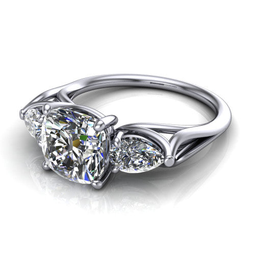 Journee cushion three stone engagement ring in 14K White Gold, three-quarter perspective showing the brilliant cushion-cut center diamond flanked by two pear side diamonds set sideways on tapered cathedral shoulders