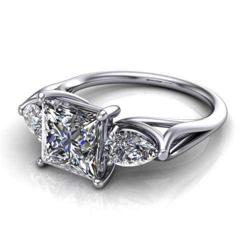Journee princess three stone engagement ring in 18K White Gold, three-quarter perspective showing the brilliant princess-cut center diamond flanked by two pear side diamonds set sideways on tapered cathedral shoulders
