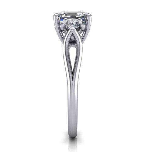 Journee square emerald three stone engagement ring in Platinum, side profile showing the split-V gallery, tapered cathedral shoulders, and polished band