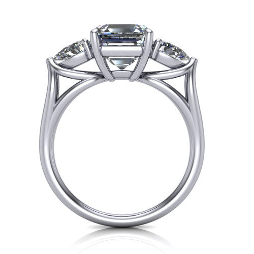 Journee square emerald three stone engagement ring in Platinum, through-finger front profile showing the three-stone head and split-V under-gallery