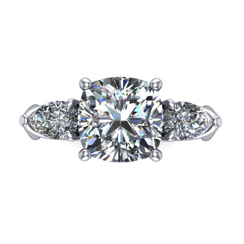 Journee cushion three stone engagement ring in 14K White Gold, top-down view showing the brilliant cushion-cut center diamond with two pear side diamonds pointing outward