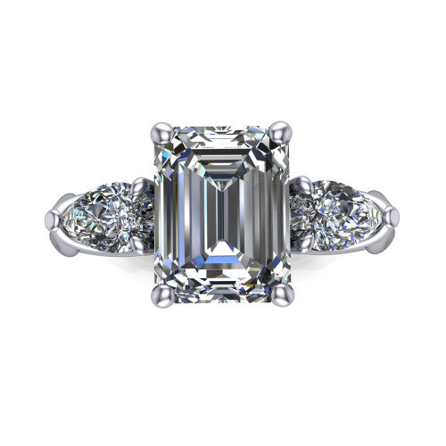 Journee emerald three stone engagement ring in 14K White Gold, top-down view showing the step-cut emerald center diamond with two pear side diamonds pointing outward