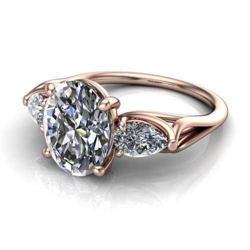 Journee oval three stone engagement ring in 14K Rose Gold, three-quarter perspective showing the brilliant oval center diamond flanked by two pear side diamonds set sideways on tapered cathedral shoulders