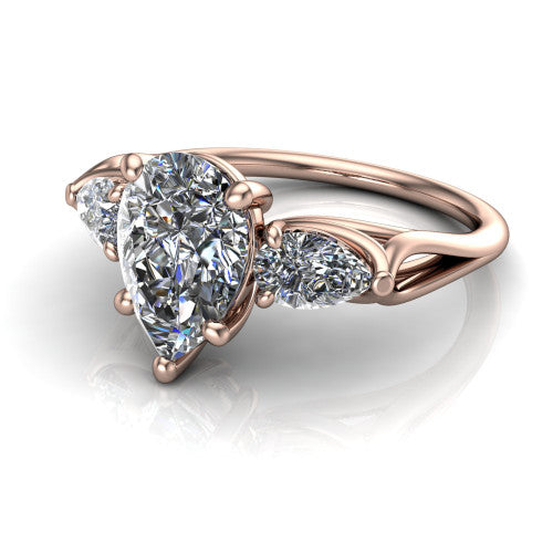 Journee pear three stone engagement ring in 14K Rose Gold, three-quarter perspective showing the brilliant pear-cut center diamond flanked by two pear side diamonds set sideways on tapered cathedral shoulders