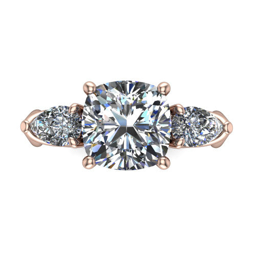 Journee cushion three stone engagement ring in 18K Rose Gold, top-down view showing the brilliant cushion-cut center diamond with two pear side diamonds pointing outward