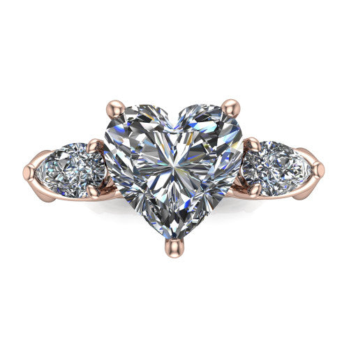 Journee heart three stone engagement ring in 14K Rose Gold, top-down view showing the brilliant heart-shaped center diamond with two pear side diamonds pointing outward