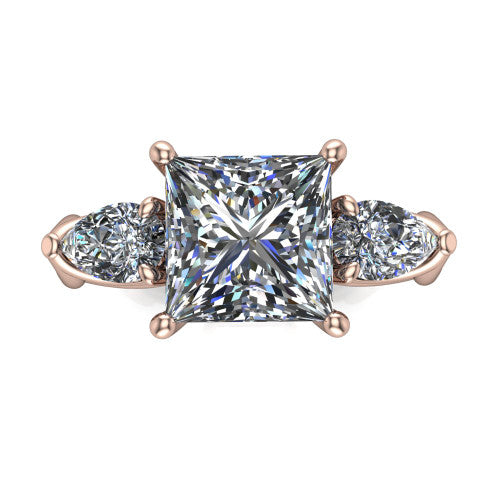 Journee princess three stone engagement ring in 18K Rose Gold, top-down view showing the brilliant princess-cut center diamond with two pear side diamonds pointing outward