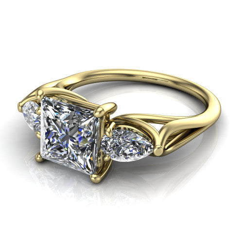 Journee princess three stone engagement ring in 14K Yellow Gold, three-quarter perspective showing the brilliant princess-cut center diamond flanked by two pear side diamonds set sideways on tapered cathedral shoulders