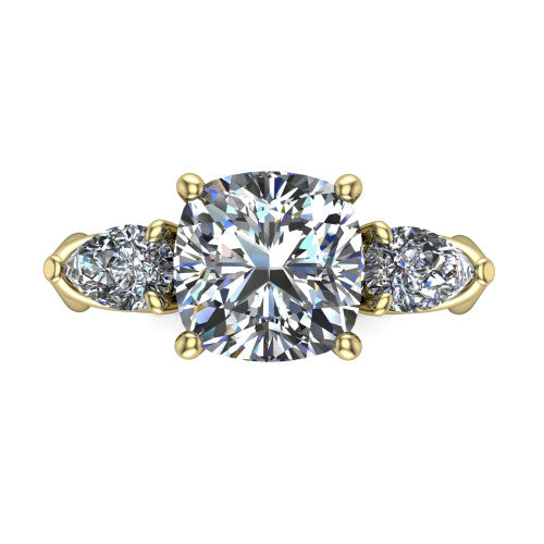 Journee cushion three stone engagement ring in 18K Yellow Gold, top-down view showing the brilliant cushion-cut center diamond with two pear side diamonds pointing outward