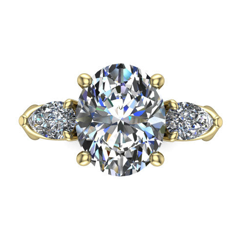 Journee oval three stone engagement ring in 18K Yellow Gold, top-down view showing the brilliant oval center diamond with two pear side diamonds pointing outward