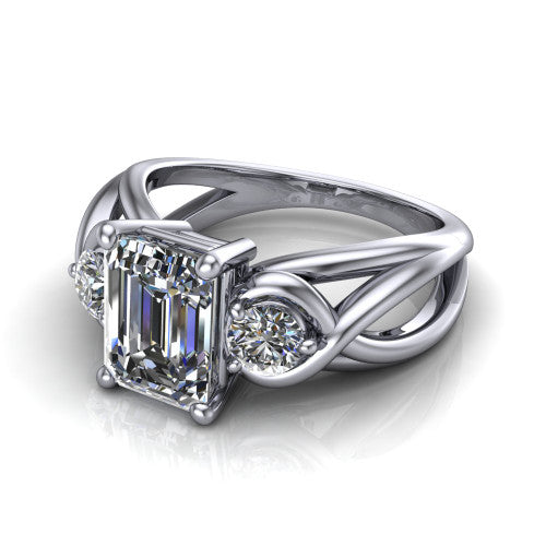 Ottilie emerald three stone engagement ring in 14K White Gold, three-quarter perspective showing the step-cut emerald center diamond flanked by two round side diamonds on a braided ribbon shank