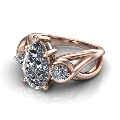 Ottilie pear three stone engagement ring in 18K Rose Gold, three-quarter perspective showing the brilliant pear-cut center diamond flanked by two round side diamonds on a braided ribbon shank