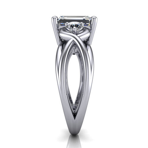Ottilie emerald three stone engagement ring in Platinum, side profile showing the braided ribbon shank with multiple bands twisting beneath the head